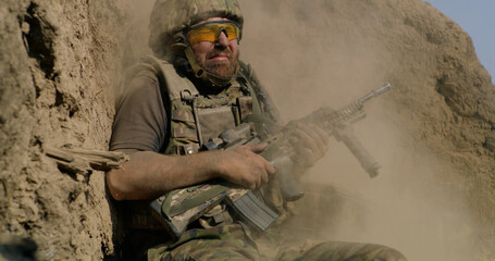 Scared soldier firing gun in air