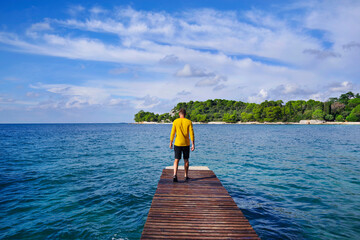 Man on a wooden pier in Rovinj, Croatia, Europe