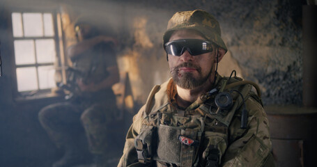 Fototapeta premium Confident American soldier in desolate building