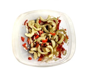 Cucumber salad with tomato and onion on white background, vegan food