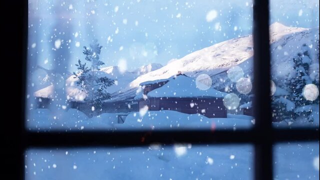 Snowy winter scene with snow falling on house. View of mountains. Cinemagraph. Inside looking out.