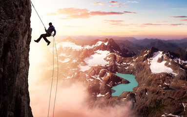 Epic Adventurous Extreme Sport Composite of Rock Climbing Man Rappelling from a Cliff. Mountain Landscape Background from British Columbia, Canada.