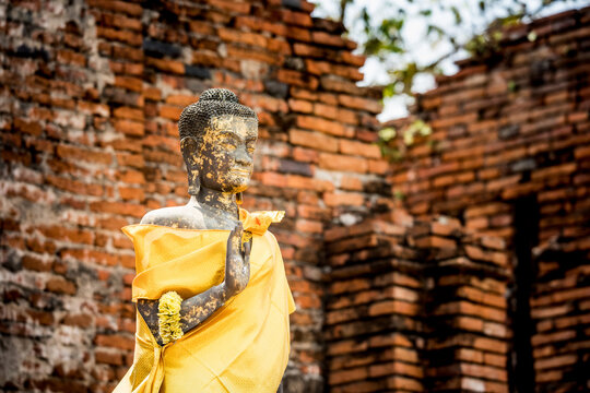 Old and ancient image of Buddha in Thai temple. Ayuthaya Province, Thailand.