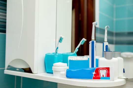 Oral hygiene kit on a white shelf. Side view