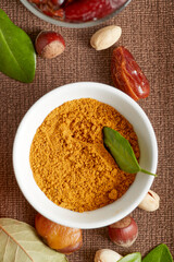 Various raw nuts: hazelnuts, pistachios, chestnuts, dates and oranges.