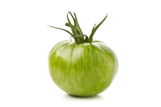 Single Unripe Green Tomato Over White Background, Unripe Tomatoes Can Be Fried Or Used For Relish