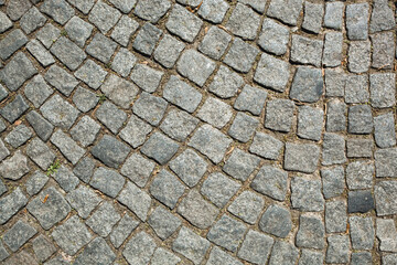 Stone pavement texture. Granite cobblestoned pavement background