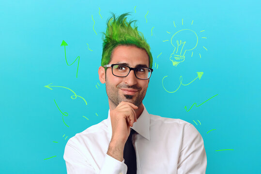Creative businessman with green hair thinks about a crazy project