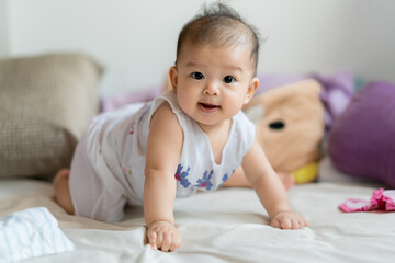 Baby smiling and adorable asian girl portrait c;ose up 