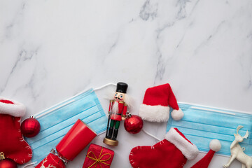 Christmas santa hat on a protective coronavirus face mask