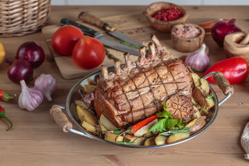 Roast Pork Loin with ribas and baked vegetables on kitchen table