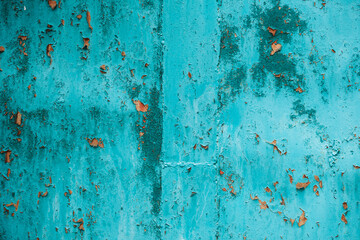 Turqouise grunge wall with scratches, scuffs and rust. Wallpaper, texture background. 