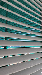 Obraz premium Striped background of white and blue shutters