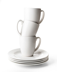 Porcelain cups and plates on white background, photo taken in studio