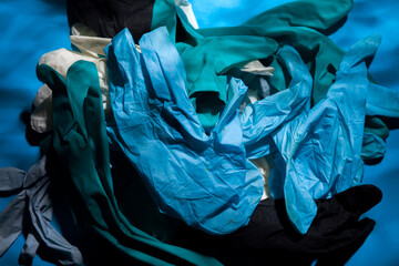 Used disposable medical rubber gloves used by doctors against SARS-CoV-2 or COVID-19 coronavirus...