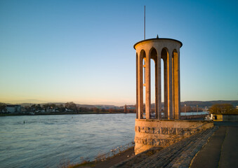 Gauge tower of Neuwied, Germany at the river Rhine with blue sky in the evening sun - copy space