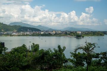 Aerial view of the Lakeside area in Pokhara city, Nepal, with the surrounding hills and Phewa Lake