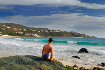 Muscle man doll watching the surf on Guana Bay Beach