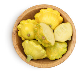 yellow pattypan squash in wooden bowl isolated on white background. Top view with clipping path