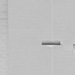 White vintage rough sheet of carton. Recycled environmentally friendly cardboard paper texture. Simple gray minimalist papercraft background.