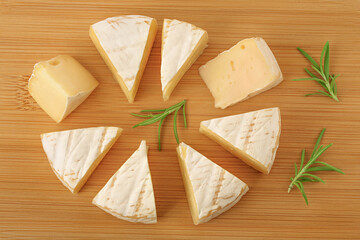 Camembert cheese on wooden background with full depth of field. Top view. Flat lay