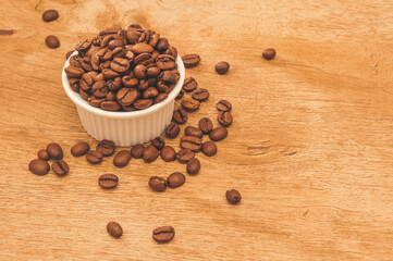Arabica coffee bean.Produced in Brazil.View from above.Wood background. Space for text