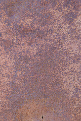 The texture of an old metal surface pitted with rust.
