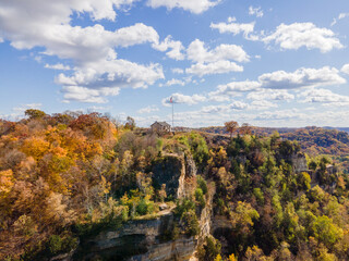 Granddad Bluff in La Crosse Wisconsin during fall, as it leaves are changing the flag is flying the...