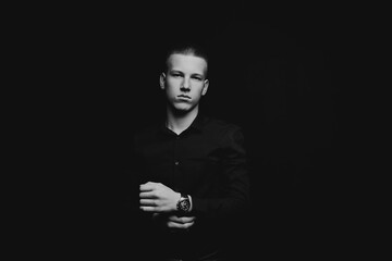 Portrait of a guy on a black background.