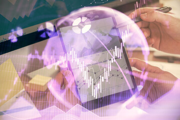 Double exposure of man's hands holding and using a phone and financial chart drawing. Market analysis concept.