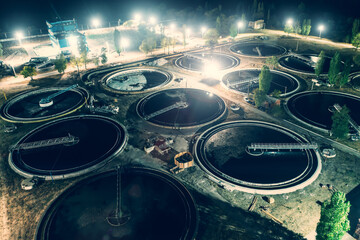 Treatment plant with tanks for purification and filtration of urban waste water, aerial view at...