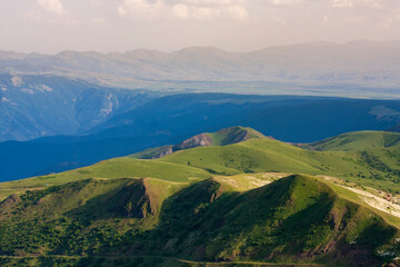 Beautiful landscape to beautiful green hills with bushes and trees on a sunny day in Northern Iran