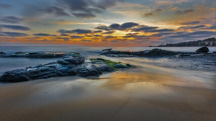 Dusk on a sandy/rocky beach