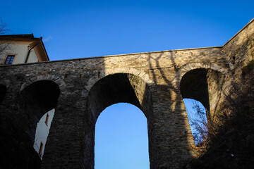 Fototapeta premium Old bridge of historical center of Cesky Krumlov, Czech Republic