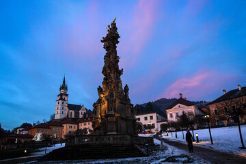Naklejka premium Central square with Plague Column by winter, Kremnica, Slovakia