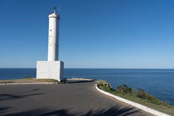 Fototapeta na wymiar Beautiful view of the lighthouse and the sea. Ponta Negra Lighthouse. The city of Ponta Negra, State of Rio de Janeiro, Brazil. 
