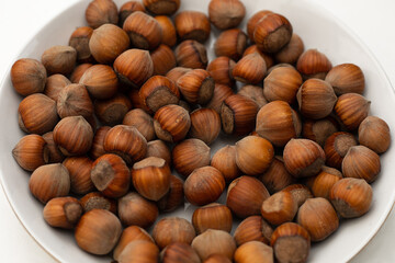 Hazelnuts. Stack of hazelnuts. Food background. Hazelnut background. Nutrients, flatlay. Close-up photo. Healthy food concept