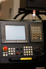 CNC machine control panel with alarm signal