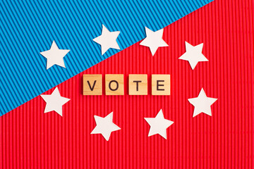 Word VOTE around the stars on blue and red background.