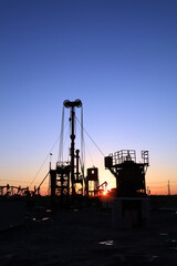 Fototapeta premium In the evening, oil field site under construction
