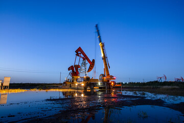In the evening, oil field site under construction