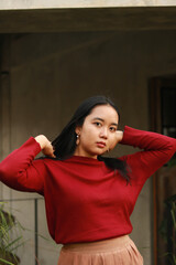 Young beautiful woman wearing red casual t-shirt.