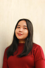 Young beautiful woman wearing red casual t-shirt.
