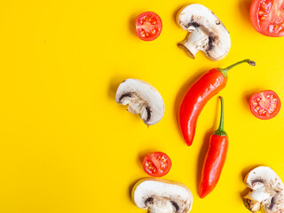 tomato, pepper, mushroom isolated on yellow