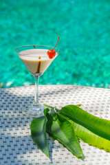 refreshment non alcohol milk cocktail in glass with cherry fruit decoration