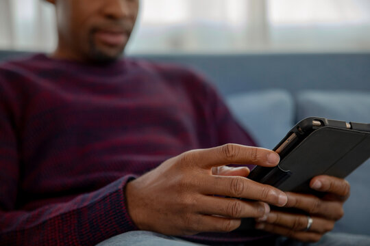 Man reading digital portable tablet