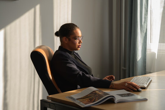 businesswoman sitting at a desk in an office