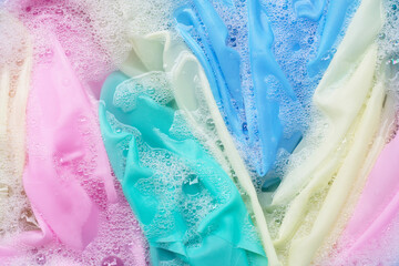Color clothes soak in powder detergent water dissolution. Laundry concept