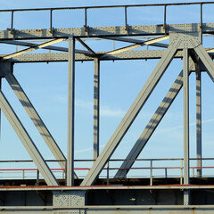 Naklejka premium Details of the railway and road bridge across the river.