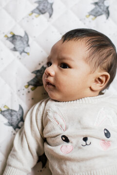 Baby on White Blanket
